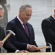 Speaker of the House Paul Ryan (right, R-Wis.) laughs as Sen. Chuck Schumer (center, D-N.Y.) and Senate Majority Leader Mitch McConnell (R-Ky.) drive nails into a piece of lumber at the First Nail Ceremony outside the U.S. Capitol in Washington, D.C., on Sept. 21, 2016.
Win McNamee/Getty Images